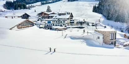 Wellnessurlaub - Babysitterservice - Hüttschlag - Für den Skiurlaub mit direktem Einstieg in das Skigebiet Hochkönig im Salzburger Land ist das 4*S-Hotel Übergossene Alm Resort die perfekte Adresse. - Übergossene Alm Resort