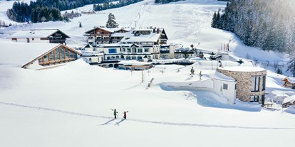Wellnessurlaub - Außensauna - Hinterglemm - Für den Skiurlaub mit direktem Einstieg in das Skigebiet Hochkönig im Salzburger Land ist das 4*S-Hotel Übergossene Alm Resort die perfekte Adresse. - Übergossene Alm Resort
