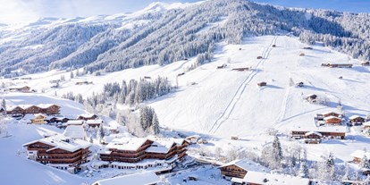 Wellnessurlaub - Wassergymnastik - Kössen - Winteransicht mit Einstieg ins Skigebiet - Galtenberg Resort 4*S
