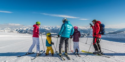 Wellnessurlaub - Preisniveau: moderat - Döbriach - Genuss beim Ski Fahren mit der Familie - Familienhotel Hinteregger