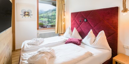 Wellnessurlaub - Umgebungsschwerpunkt: See - Tschöran - Schlafzimmer Suite Talblick - Hotel NockResort