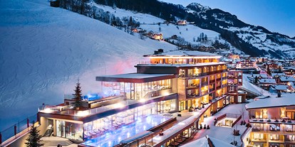 Wellnessurlaub - Thalasso-Therapie - Außenansicht Winter - DAS EDELWEISS Salzburg Mountain Resort