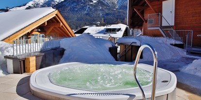 Wellnessurlaub - Ayurveda-Therapie - Garmisch-Partenkirchen - Whirlpool - Mountains Hotel