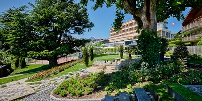 Wellnessurlaub - Umgebungsschwerpunkt: Stadt - PLZ 3658 (Schweiz) - Aussenansicht Hotel Eden Spiez und Garten Eden - Hotel Eden Spiez