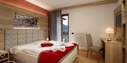 Wellnessurlaub - Ganzkörpermassage - Madonna di Campiglio - comfort room - TEVINI - Dolomites Charming Hotel
