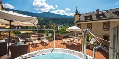 Wellnessurlaub - Kräutermassage - Seiser Alm - Dominik Alpine City Wellness Hotel