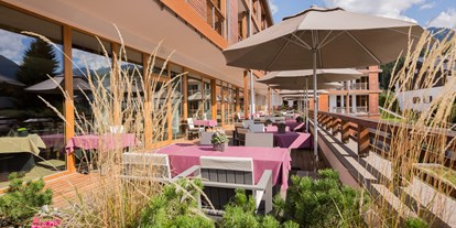 Wellnessurlaub - Textilsauna - Allgäu - Sommer auf der Terrasse - Hotel Exquisit