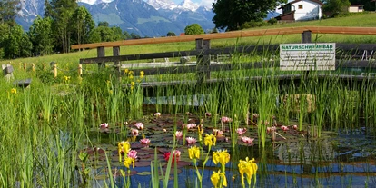 Wellnessurlaub - Außensauna - Strobl - Naturteich - Naturhotel Reissenlehen