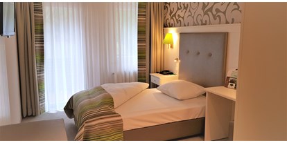Wellnessurlaub - Hotel-Schwerpunkt: Wellness & Golf - Oberkirch - Zimmerbeispiel - Waldhotel Grüner Baum