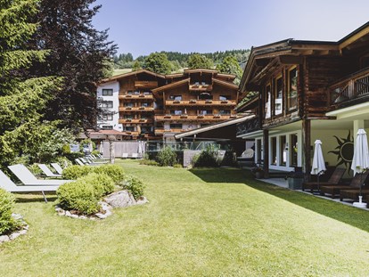 Wellnessurlaub - Peeling - Kitzbühel - Außenbereich - ALL INCLUSIVE Hotel DIE SONNE