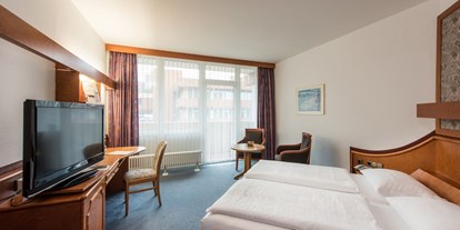 Wellnessurlaub - Außensauna - Kassel - Zimmerbeispiel Standard-Doppelzimmer im Gästehaus - Göbel's Hotel Rodenberg
