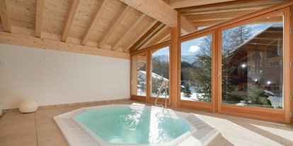 Wellnessurlaub - Rücken-Nacken-Massage - Schweiz - Whirlpool - Hotel Hemizeus und Iremia Spa