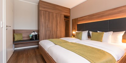 Wellnessurlaub - Komfort Suite - Schlafzimmer - Sporthotel Grafenwald