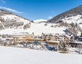 Wellnesshotel: Außenansicht Winter  - Dolomiten Residenz Sporthotel Sillian