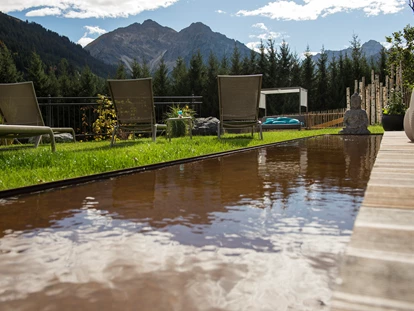 Wellnessurlaub - Fontanella - Garten Sommer - Wellnesshotel Walserhof