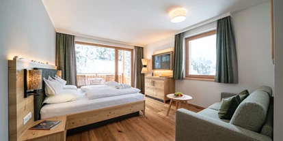Wellnessurlaub - Ladestation Elektroauto - Eden (Glödnitz) - Premium Familienzimmer - Hotel GUT Trattlerhof & Chalets****S