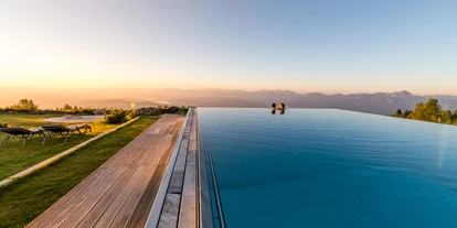 Wellnessurlaub - Ladestation Elektroauto - Eden (Glödnitz) - 4.500 m² große Bade- und Wohlfühlwelt mit 11 Pools, Almsee, 11 Saunen und 16 Ruheoasen - Feuerberg Mountain Resort