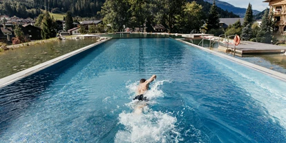 Wellnessurlaub - Ladestation Elektroauto - Eden (Glödnitz) - 7x25 Meter großes Thermal-Infinitybecken  - Hotel Pulverer