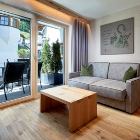 Wellnesshotel: Wohnbereich Themenzimmer Wäldgängerin  - Hotel Tirol