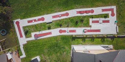 Wellnessurlaub - Day SPA - Graubünden - Hauseigener 9-Loch Minigolfplatz - Hotel Waldhuus Davos