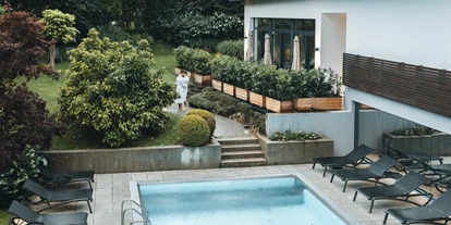 Wellnessurlaub - Restaurant - Stegersbach - Garten mit ganzjährig beheiztem Aussenpool - Vulkanlandhotel Legenstein