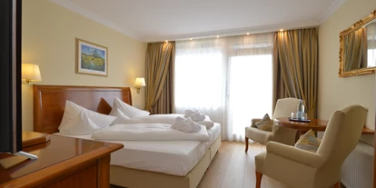 Wellnessurlaub - Schwanenstadt - Zimmerbeispiel DZ Comfort 26 qm Bio-Vinylboden - Hotel Schweizer Hof Betriebs-GmbH