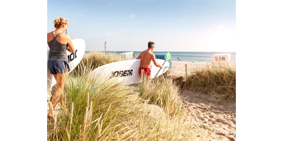 Wellnessurlaub - Schleswig - Stand-Up-Paddling am Aktionsstrand Dampland - Ostseehotel Midgard in Damp