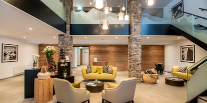 Wellnessurlaub - Babysitterservice - Reception - Walliserhof Grand-Hotel & Spa