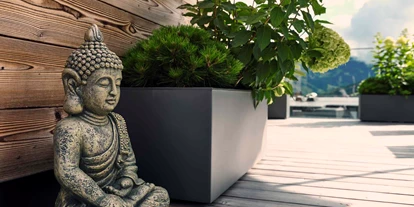 Wellnessurlaub - Pilates - Buddha auf Terrasse - Hotel Hasenauer
