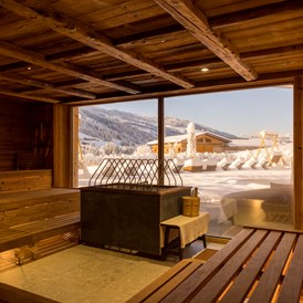 Wellnesshotel: Panoramasauna mit winterlicher Aussicht© Alpbacherhof Matthias Sedlak - Alpbacherhof****s - Mountain & Spa Resort