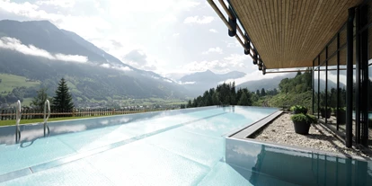 Wellnessurlaub - Day SPA - Altenmarkt im Pongau - Infinity Pool mit Ausblick DAS.GOLDBERG - DAS.GOLDBERG